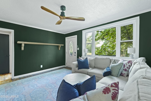 174 James St, Beaufort, SC 29902 - living area with ceiling fan, ornamental molding, wood finished floors, and a textured ceiling