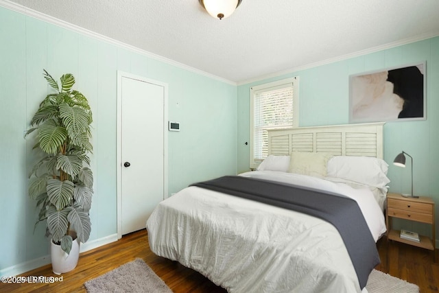 174 James St, Beaufort, SC 29902 - bedroom with ornamental molding, wood finished floors, and a textured ceiling