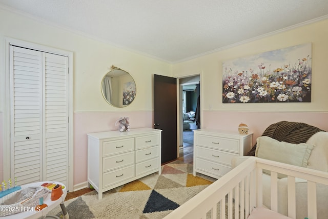 174 James St, Beaufort, SC 29902 - bedroom with ornamental molding, light wood-style flooring, and a closet