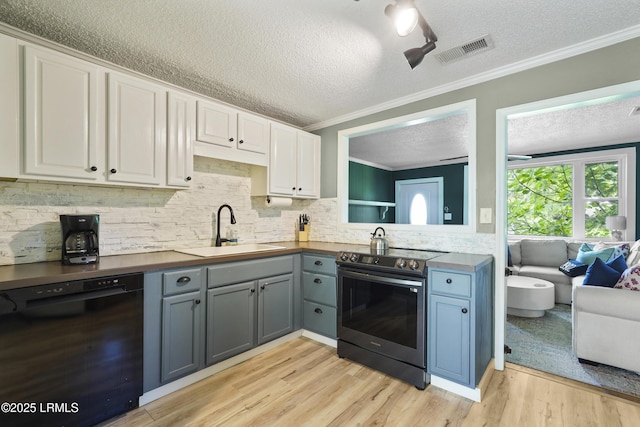 174 James St, Beaufort, SC 29902 - kitchen featuring dishwasher, stainless steel range with electric stovetop, a textured ceiling, ornamental molding, and light wood-type flooring