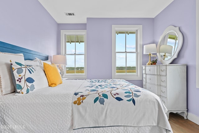 70 Brams Point Rd, Hilton Head Island, SC 29926 - bedroom featuring wood finished floors and baseboards