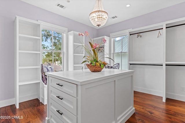 70 Brams Point Rd, Hilton Head Island, SC 29926 - walk in closet with dark wood-style floors and a chandelier