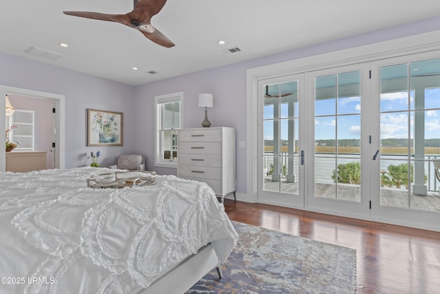 70 Brams Point Rd, Hilton Head Island, SC 29926 - bedroom with access to exterior, wood finished floors, a water view, recessed lighting, and ceiling fan