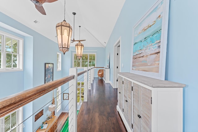 70 Brams Point Rd, Hilton Head Island, SC 29926 - hall with an upstairs landing, vaulted ceiling, dark wood finished floors, a chandelier, and baseboards