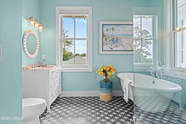 70 Brams Point Rd, Hilton Head Island, SC 29926 - bathroom with tile patterned floors, plenty of natural light, a freestanding tub, and baseboards