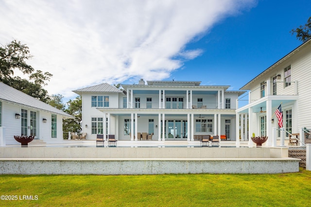 70 Brams Point Rd, Hilton Head Island, SC 29926 - rear view of property with french doors, a balcony, and a patio area