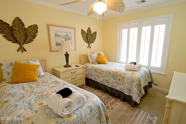 bedroom with crown molding, a ceiling fan, baseboards, and visible vents