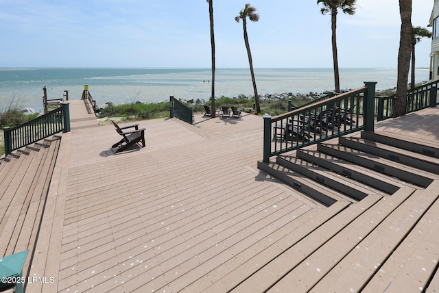 wooden terrace with a water view