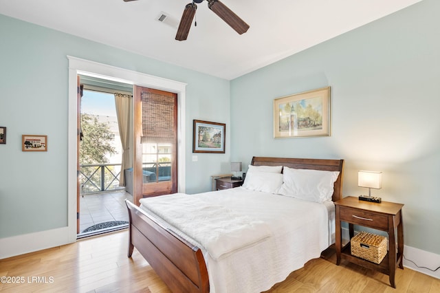 bedroom with light wood finished floors, visible vents, baseboards, ceiling fan, and access to outside