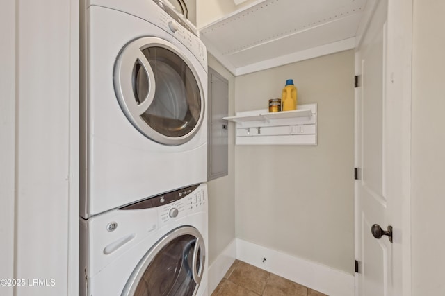 6 Abbey Row Unit 2A, Beaufort, SC 29906 - washroom with baseboards, tile patterned flooring, laundry area, and stacked washer / dryer