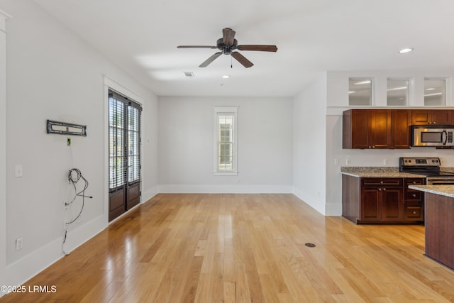 6 Abbey Row Unit 2A, Beaufort, SC 29906 - kitchen with a wealth of natural light, ceiling fan, light wood-style flooring, and appliances with stainless steel finishes