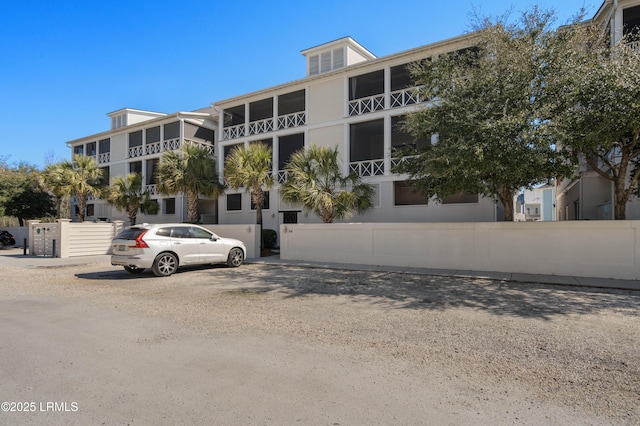 view of building exterior featuring fence