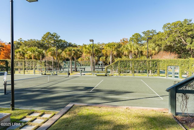 view of sport court with fence