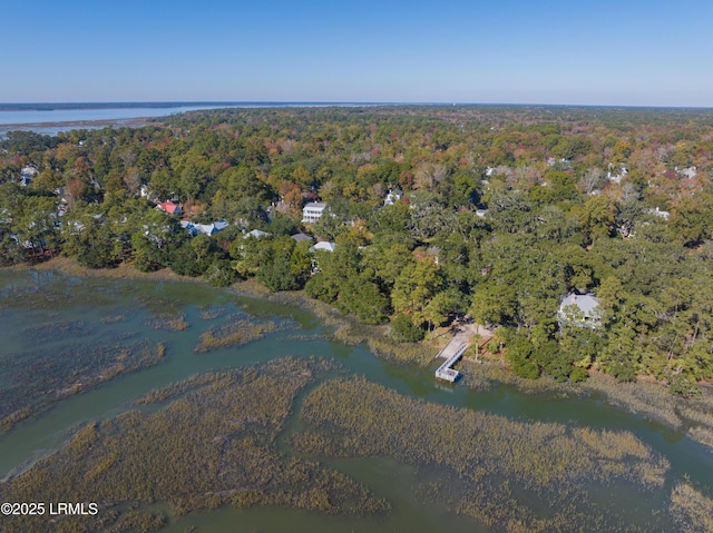 aerial view featuring a water view and a wooded view