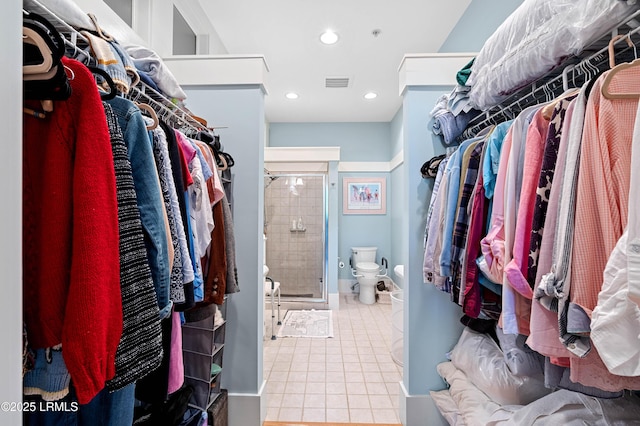 walk in closet with visible vents and tile patterned floors