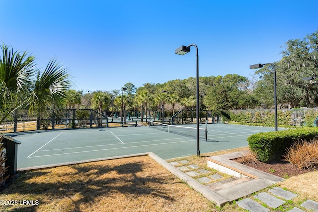 view of sport court with fence