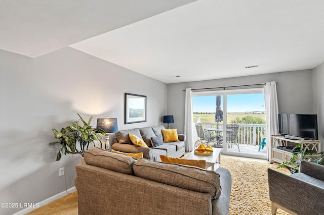 living room with visible vents and baseboards