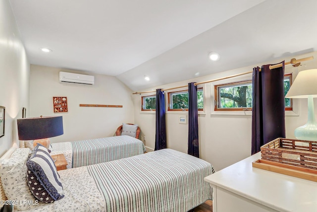 bedroom featuring lofted ceiling and a wall mounted AC