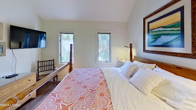 bedroom featuring hardwood / wood-style flooring and vaulted ceiling