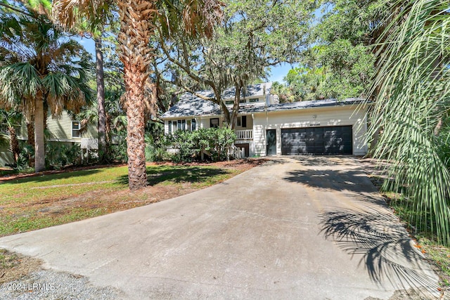 view of front facade with a garage and a front yard