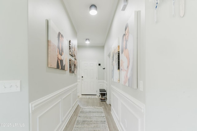 173 Okatie Park Cir E, Ridgeland, SC 29936 - hall featuring light wood-style flooring, a decorative wall, and wainscoting