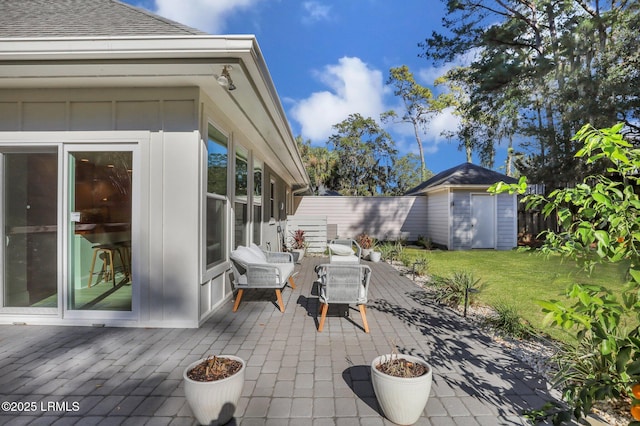 view of patio featuring a storage unit