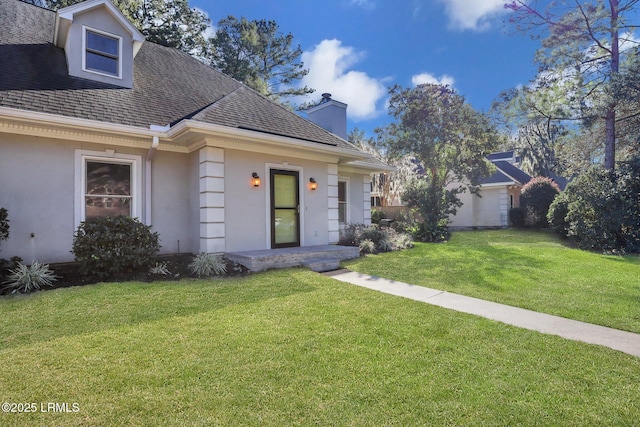 view of front of home with a front yard