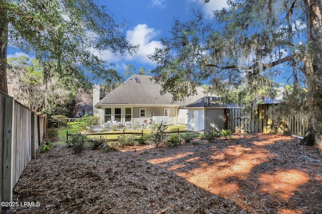 rear view of house featuring a patio