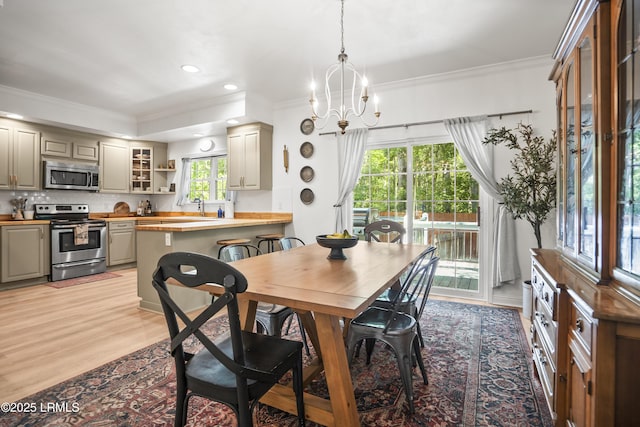 5 Summer Field Ct, Beaufort, SC 29907 - dining area featuring crown molding, light wood-style flooring, recessed lighting, and a chandelier