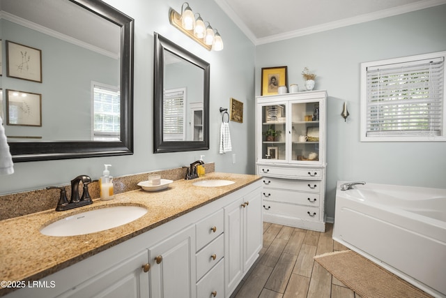 5 Summer Field Ct, Beaufort, SC 29907 - bathroom featuring crown molding, wood finished floors, a bath, and double vanity