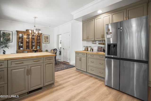 5 Summer Field Ct, Beaufort, SC 29907 - kitchen with stainless steel fridge, butcher block counters, gray cabinetry, a chandelier, and crown molding
