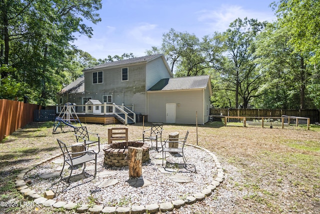 5 Summer Field Ct, Beaufort, SC 29907 - back of house with an outdoor fire pit, a wooden deck, and roof with shingles