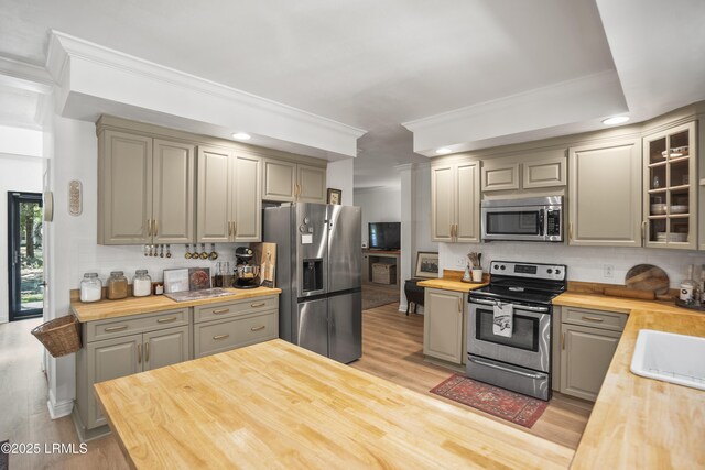 5 Summer Field Ct, Beaufort, SC 29907 - kitchen featuring wood counters, appliances with stainless steel finishes, gray cabinetry, backsplash, and ornamental molding