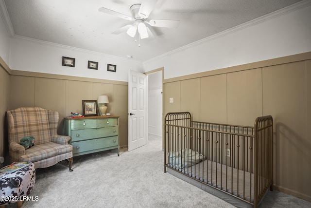 5 Summer Field Ct, Beaufort, SC 29907 - bedroom with a decorative wall, carpet flooring, ornamental molding, a ceiling fan, and a wainscoted wall