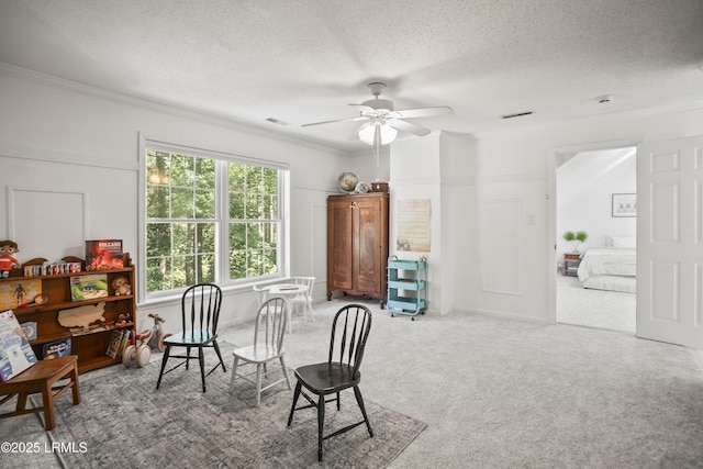 5 Summer Field Ct, Beaufort, SC 29907 - dining area with a textured ceiling, a ceiling fan, carpet floors, and crown molding