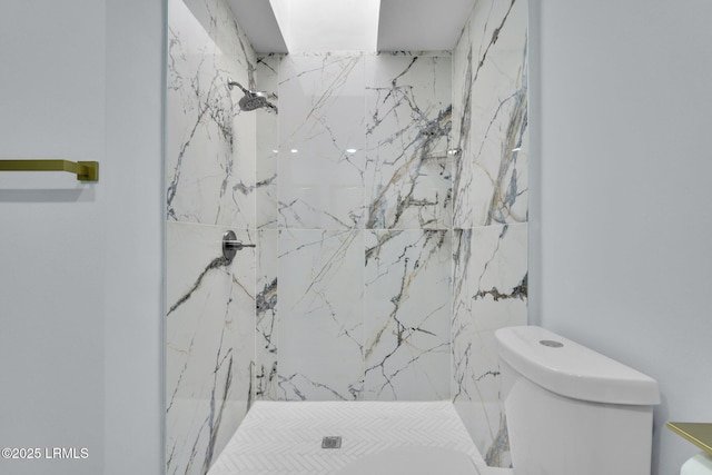 full bathroom featuring a marble finish shower and toilet