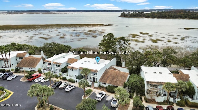 aerial view featuring a water view and a residential view