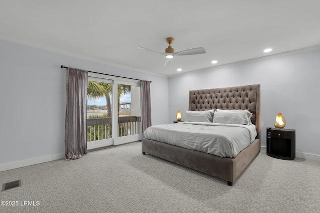 carpeted bedroom featuring access to outside, visible vents, crown molding, and baseboards