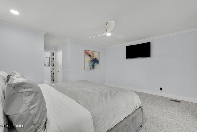 bedroom featuring visible vents, baseboards, ceiling fan, crown molding, and carpet floors