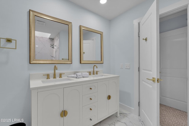 full bath featuring double vanity, marble finish floor, visible vents, and a sink