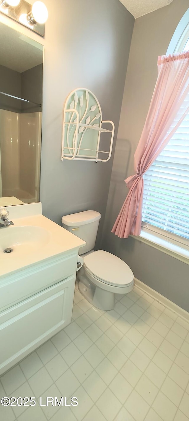 15 Grackle Ln, Beaufort, SC 29906 - full bathroom with vanity, tile patterned flooring, and a shower