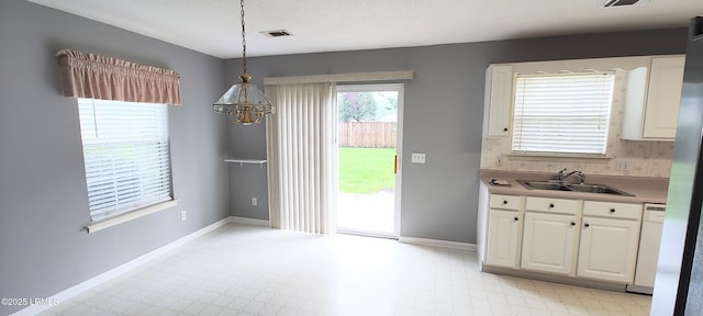 15 Grackle Ln, Beaufort, SC 29906 - dining room featuring a chandelier and light floors