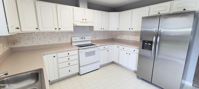 15 Grackle Ln, Beaufort, SC 29906 - kitchen featuring stainless steel refrigerator with ice dispenser, white electric range, under cabinet range hood, and white cabinetry