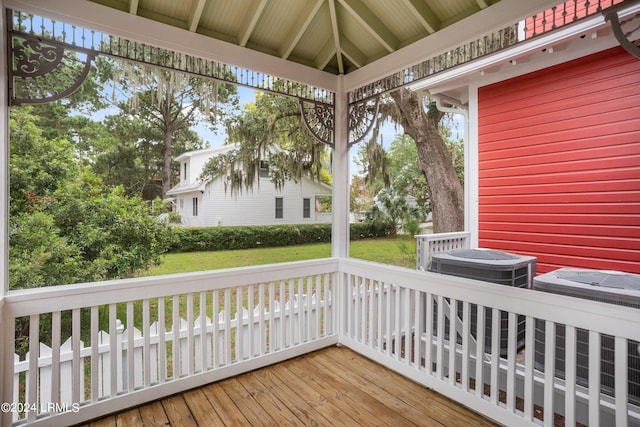 wooden deck featuring a gazebo, a yard, and central air condition unit