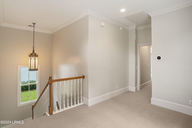 hall featuring ornamental molding and light colored carpet