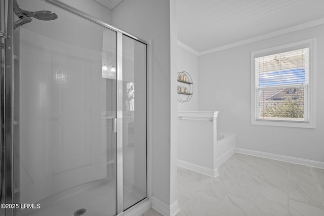 bathroom with baseboards, marble finish floor, a shower stall, and crown molding