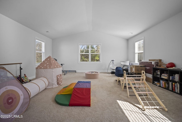 playroom featuring plenty of natural light, baseboards, and vaulted ceiling