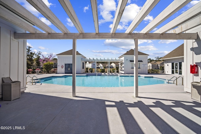 community pool with a patio area, fence, a pergola, and an outdoor structure