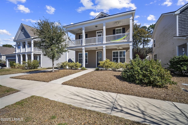 greek revival inspired property with a balcony