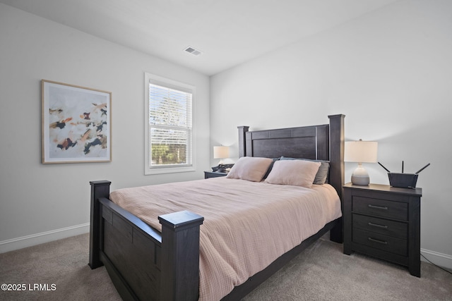 carpeted bedroom with baseboards and visible vents